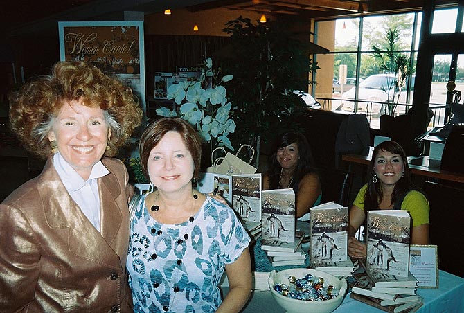 Hilda with a happy reader and great Brown Books helpers.